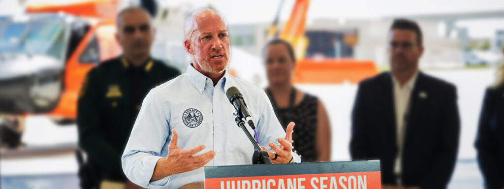 Nick speaking at podium